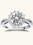 Close-up of sterling silver halo ring with brilliant round moissanite center stone surrounded by smaller accent stones
