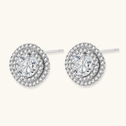 Double halo sterling silver stud earrings with brilliant round moissanite center stones and pavé crystal accents