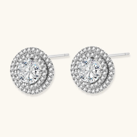 Double halo sterling silver stud earrings with brilliant round moissanite center stones and pavé crystal accents