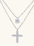 Two delicate sterling silver necklaces with moissanite stones - one solitaire pendant and one cross pendant on white background.