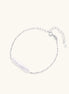 Minimalist bracelet with iridescent baroque pearl on rhodium-plated sterling silver chain against cream background
