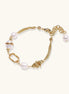14K gold plated bracelet with freshwater pearls, filigree details, and mixed geometric elements on white background.