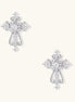 White gold-plated baroque cross studs with zirconia stones and ornate scrollwork on cream background.