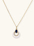Gold necklace with navy lapis lazuli stone and iridescent mother-of-pearl teardrop pendant with crystal accents