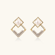 Gold-plated double square frame earrings with freshwater pearl and crystal accents on white background