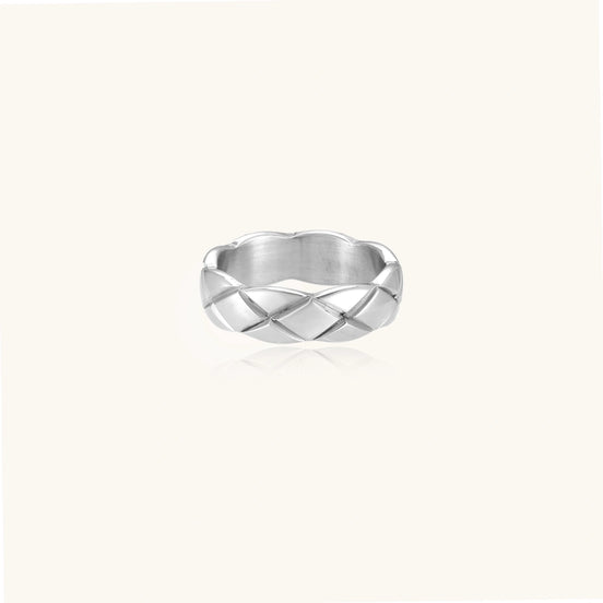 Braided stainless steel band ring with geometric interwoven strands in brushed silver finish on white background