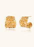 Chunky gold-plated hoop earrings with organic crumpled texture on cream background, 21.5mm sculptural design
