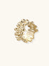 Gold-plated brass ring with sculptural petal-like elements in a wide band design on beige background