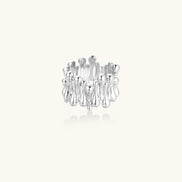 Wide band ring with sculptural wave ripples in polished white gold plated eco-brass on cream background